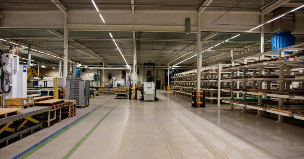 Modern industrial loft kitchen with exposed brick walls and metal accents.